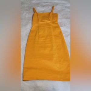 Antonio Melani dark gold/yellow colored. size 4, back zipper. Knee length